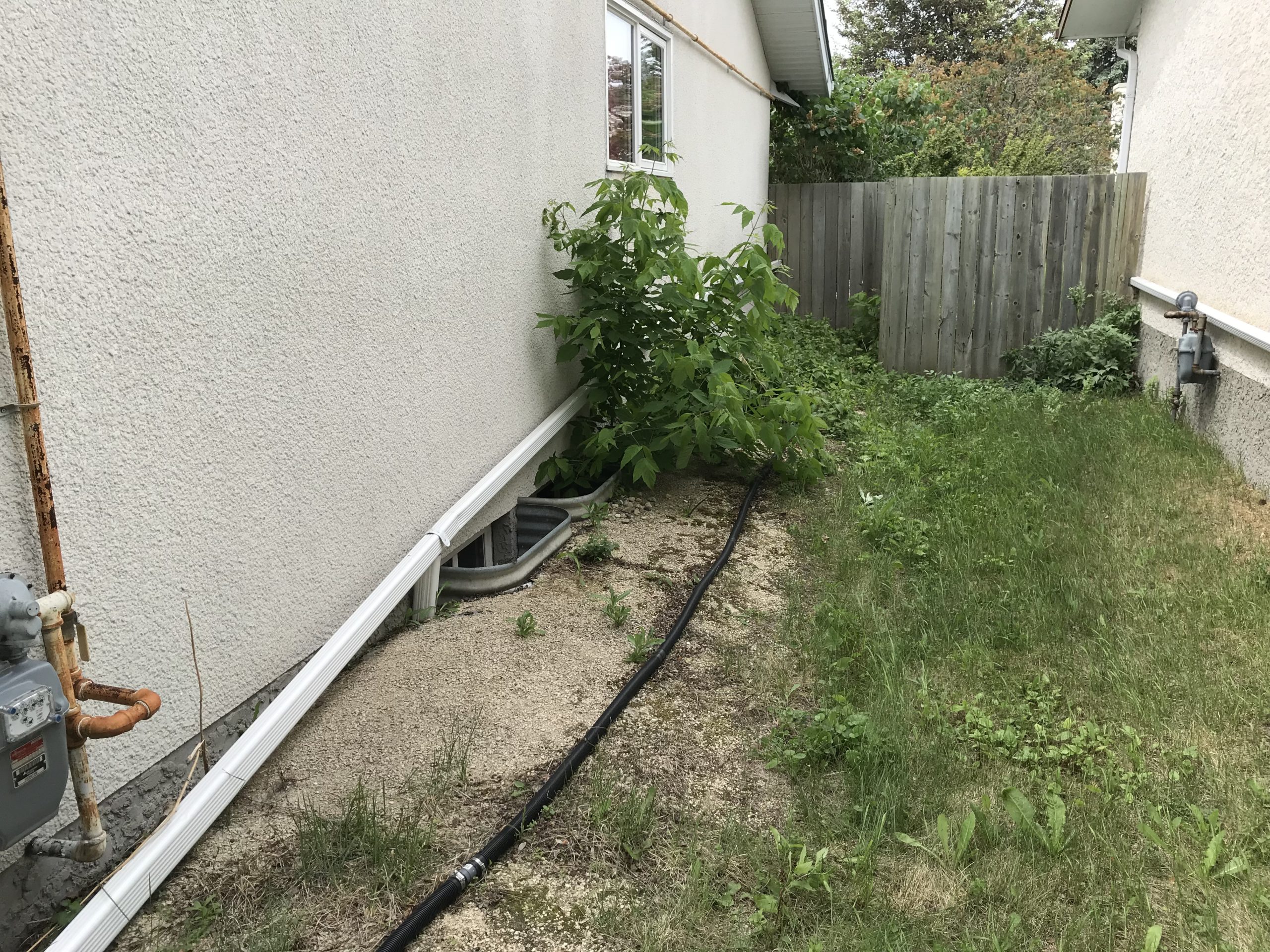 Side foundation before rock landscaping