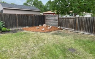 New flower bed with stack stone and mulch